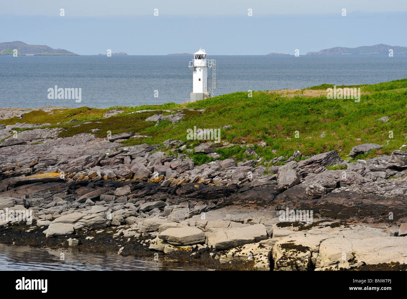 Rhue lighthouse and Rubha Cadail. Loch Broom, Ross and Cromarty, Scotland, United Kingdom, Europe. Stock Photo