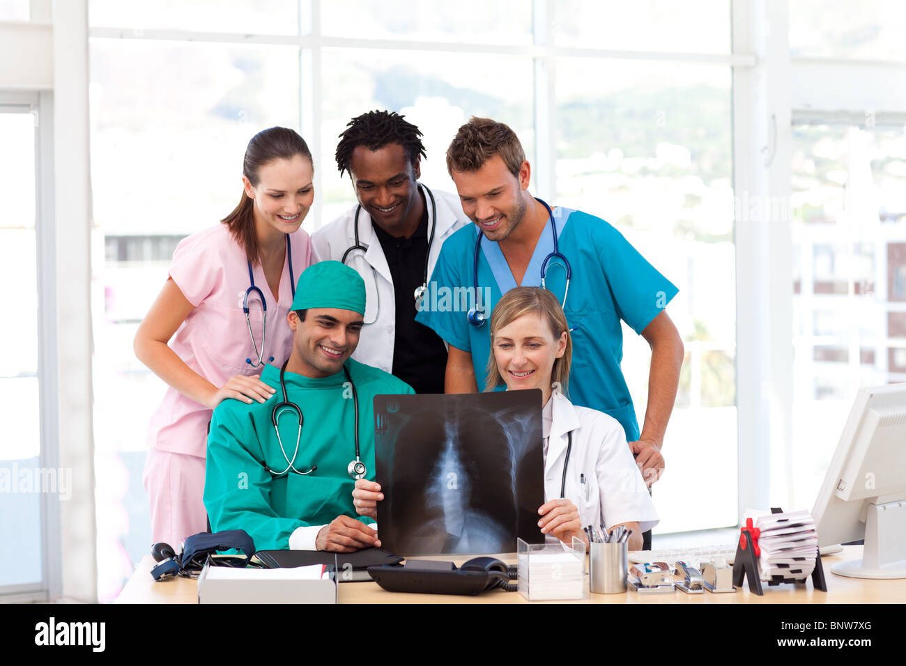 Medical team examining an X-ray Stock Photo - Alamy