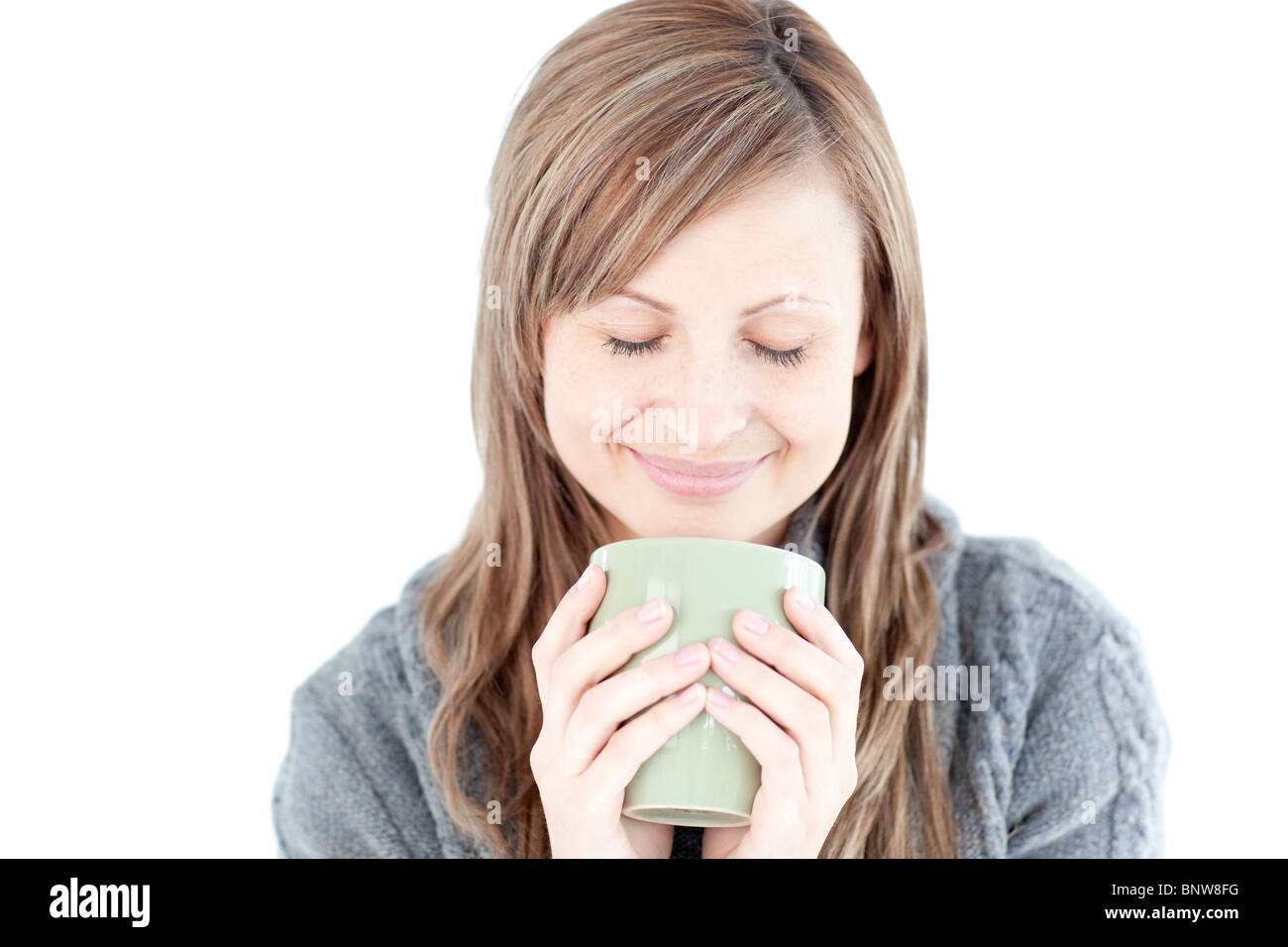 Smiling woman holding a cup a coffee Stock Photo