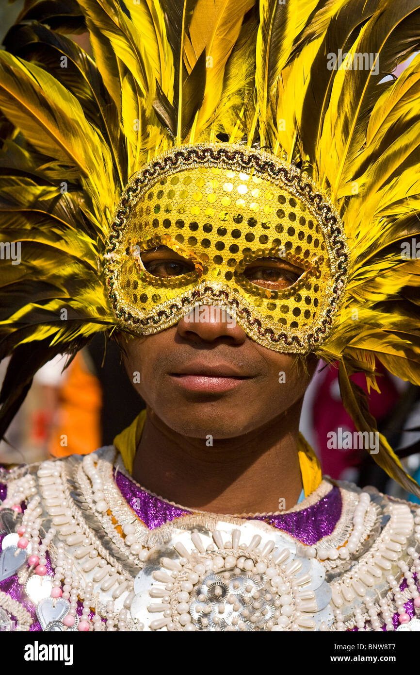 A masked Indian youth perform a Punjabi traditional folk dance Stock Photo