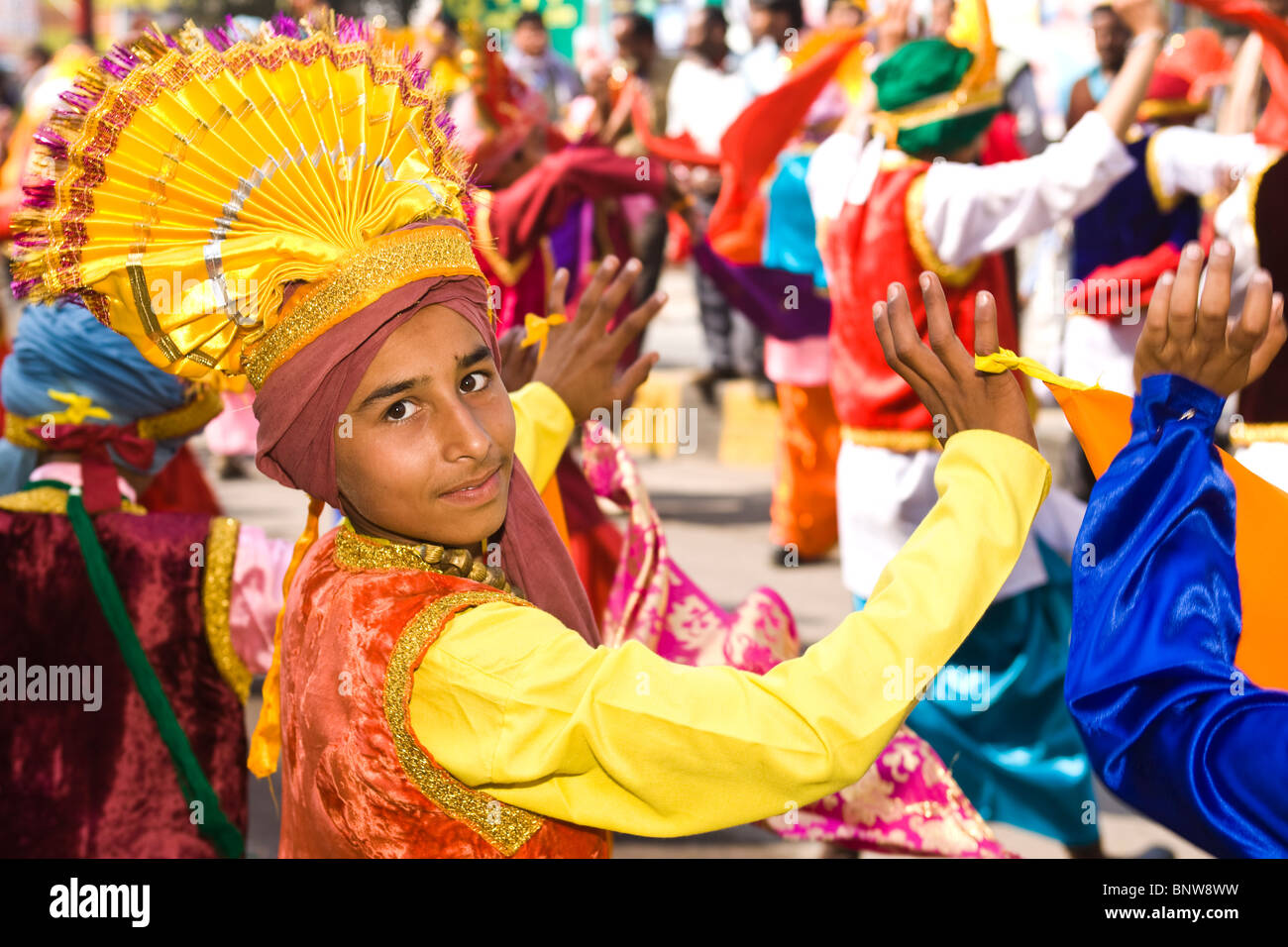 Indian youths perform a Punjabi traditional folk dance Stock Photo