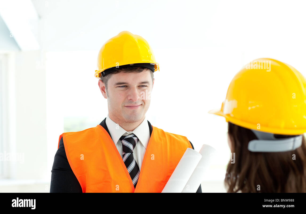 Happy architect discussing with his colleague Stock Photo