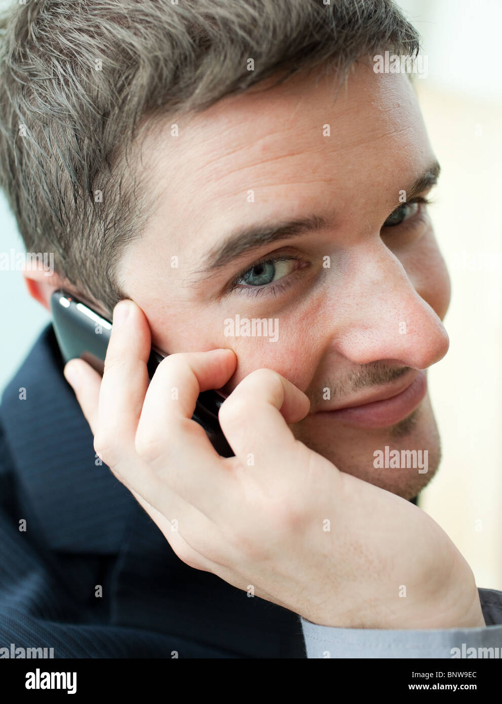 Portrait of a handsome businessman on phone Stock Photo - Alamy