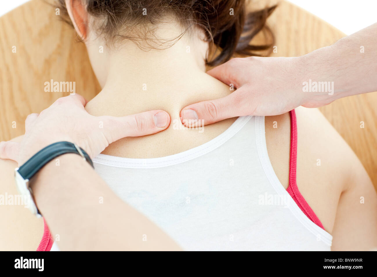 Close-up of a brunette woman receiving a back massage Stock Photo