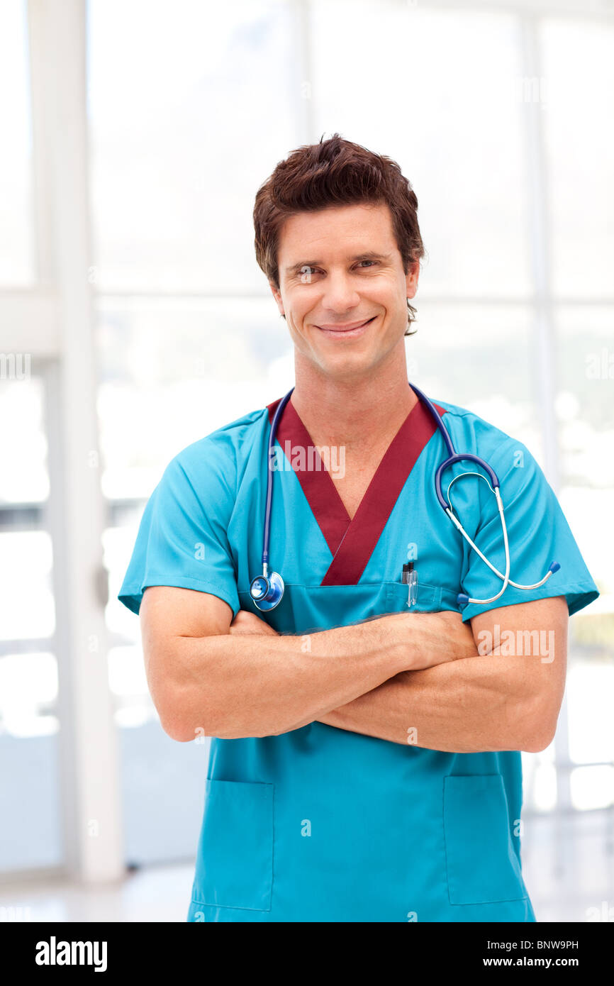 Portrait of a handsome male doctor looking at the camera Stock Photo ...