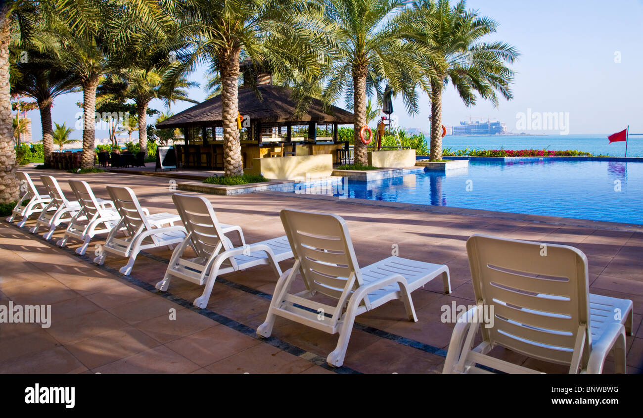 The swimming pool in one of the beach clubs on the Palm Island Jumeira in Dubai Stock Photo