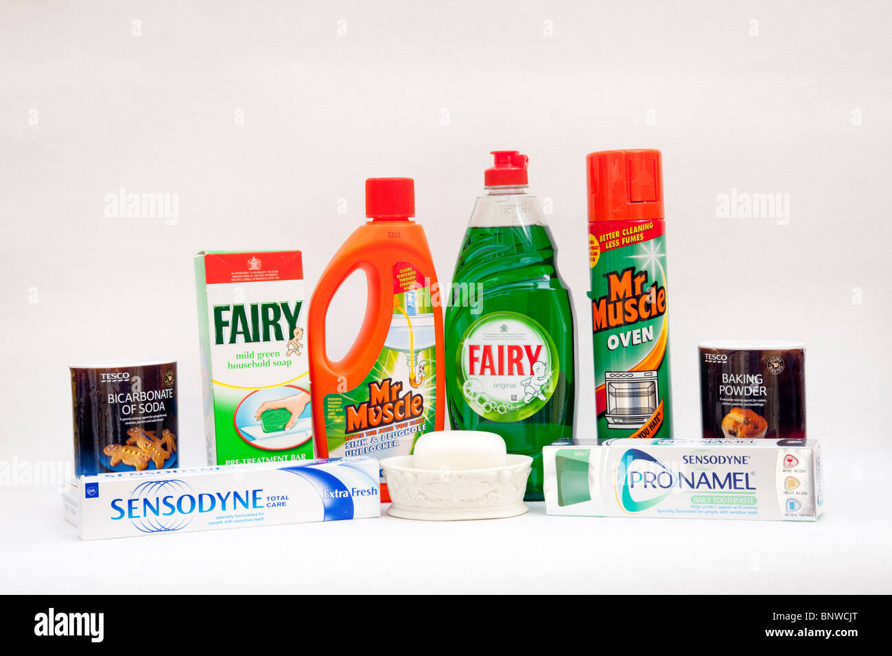 Display of household items containing alkalis including baking powder bicarbonate soap toothpaste washing up liquid oven cleaner Stock Photo