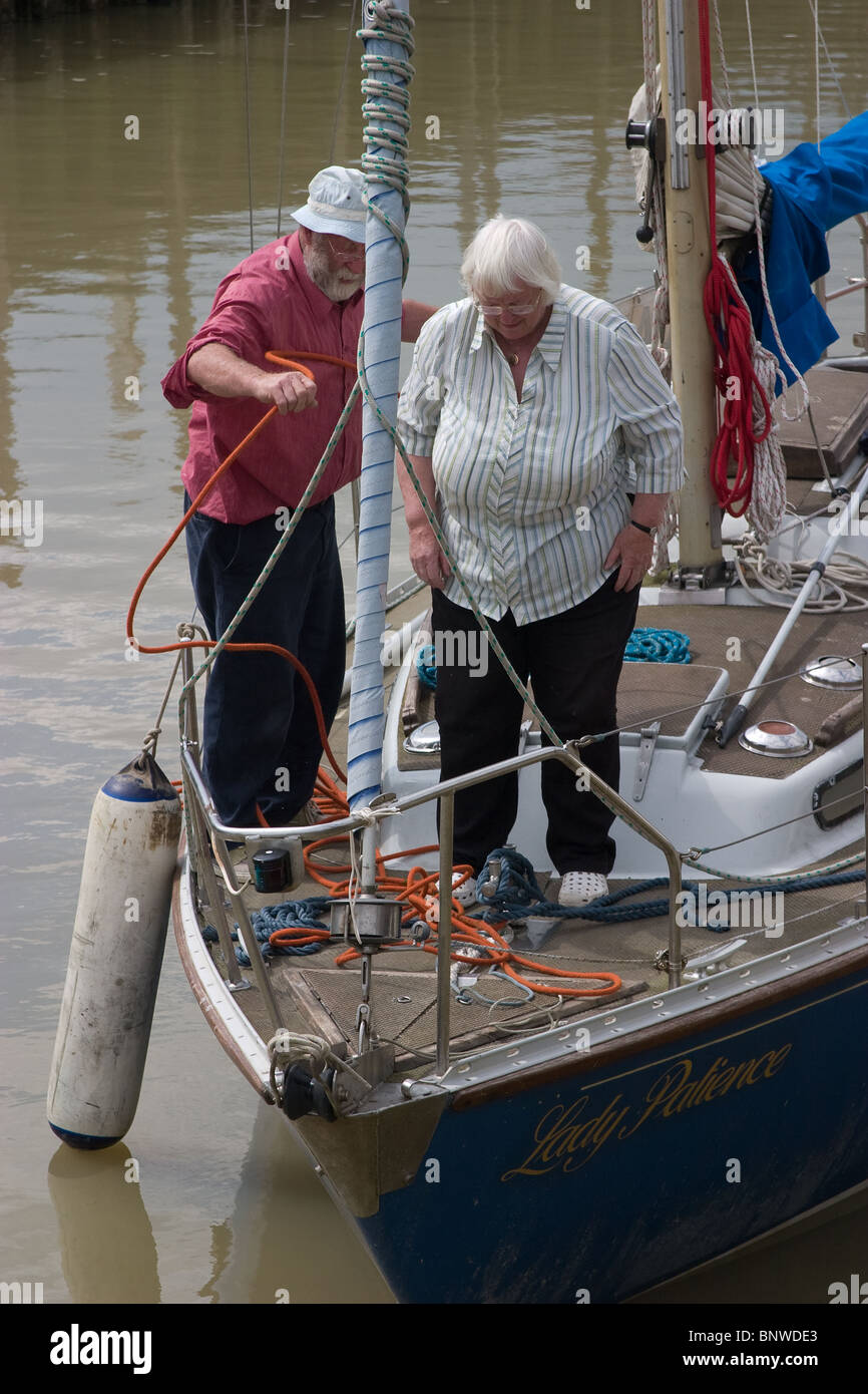 buoy double berthed sailing boat sailors talking Stock Photo