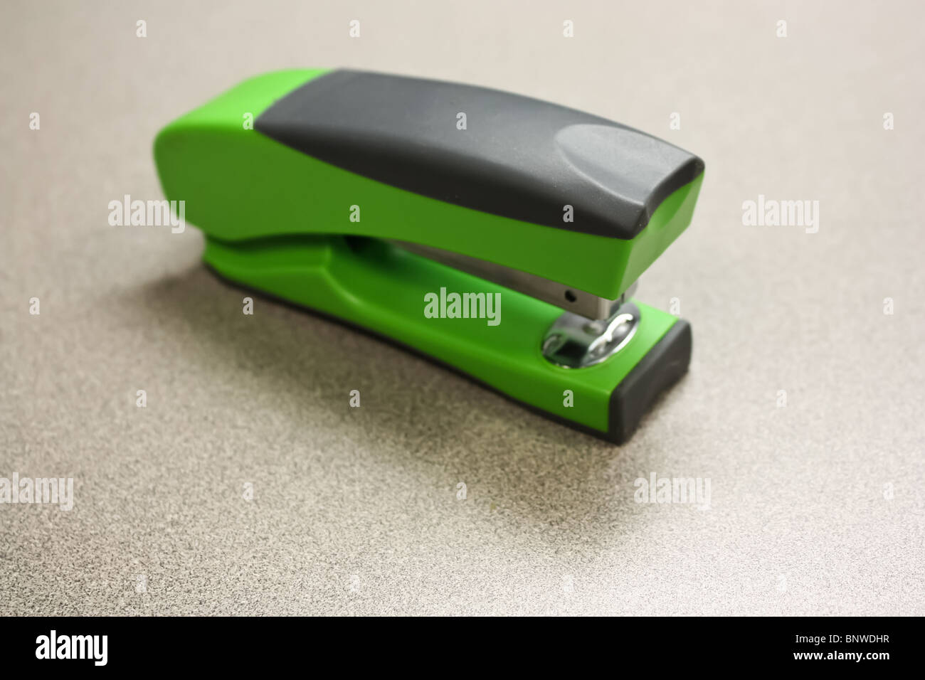 green stapler office desk Stock Photo Alamy