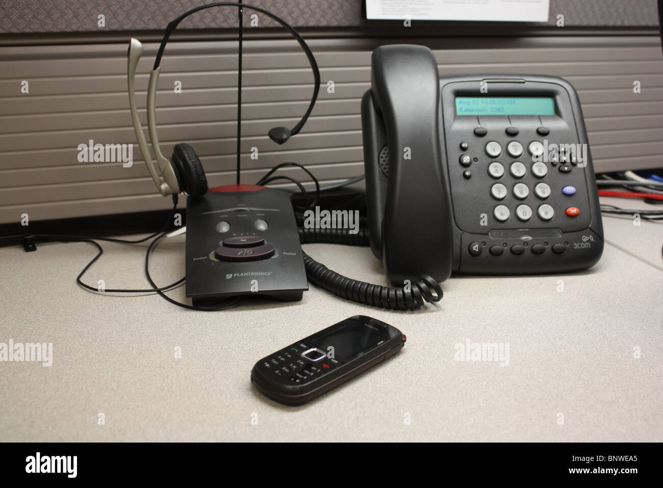 headset landline phone cell phone communication office Stock Photo