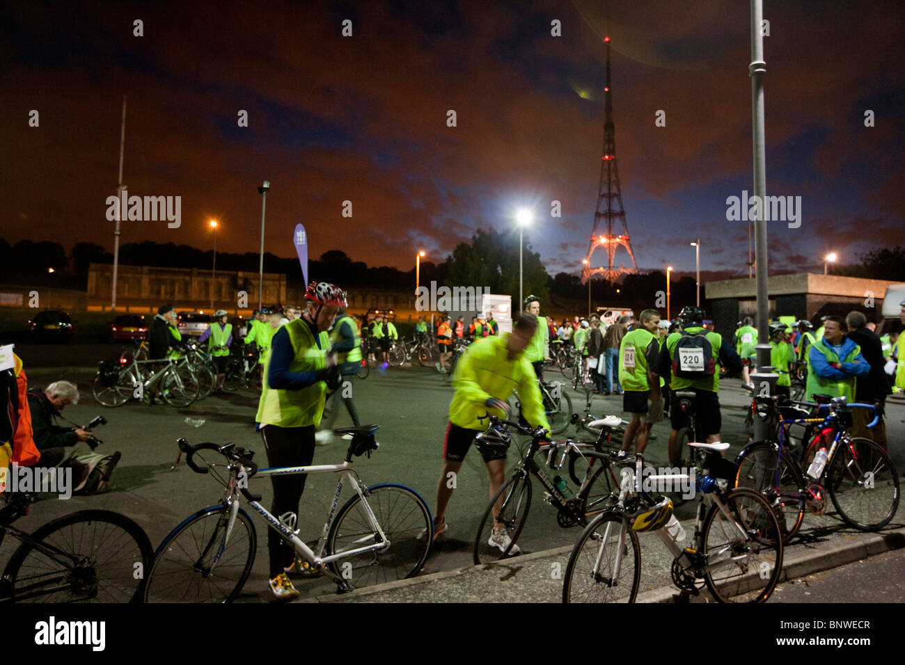 Cyclists in reflective vests prepare for the London Night Ride, London, United Kingdom Stock Photo
