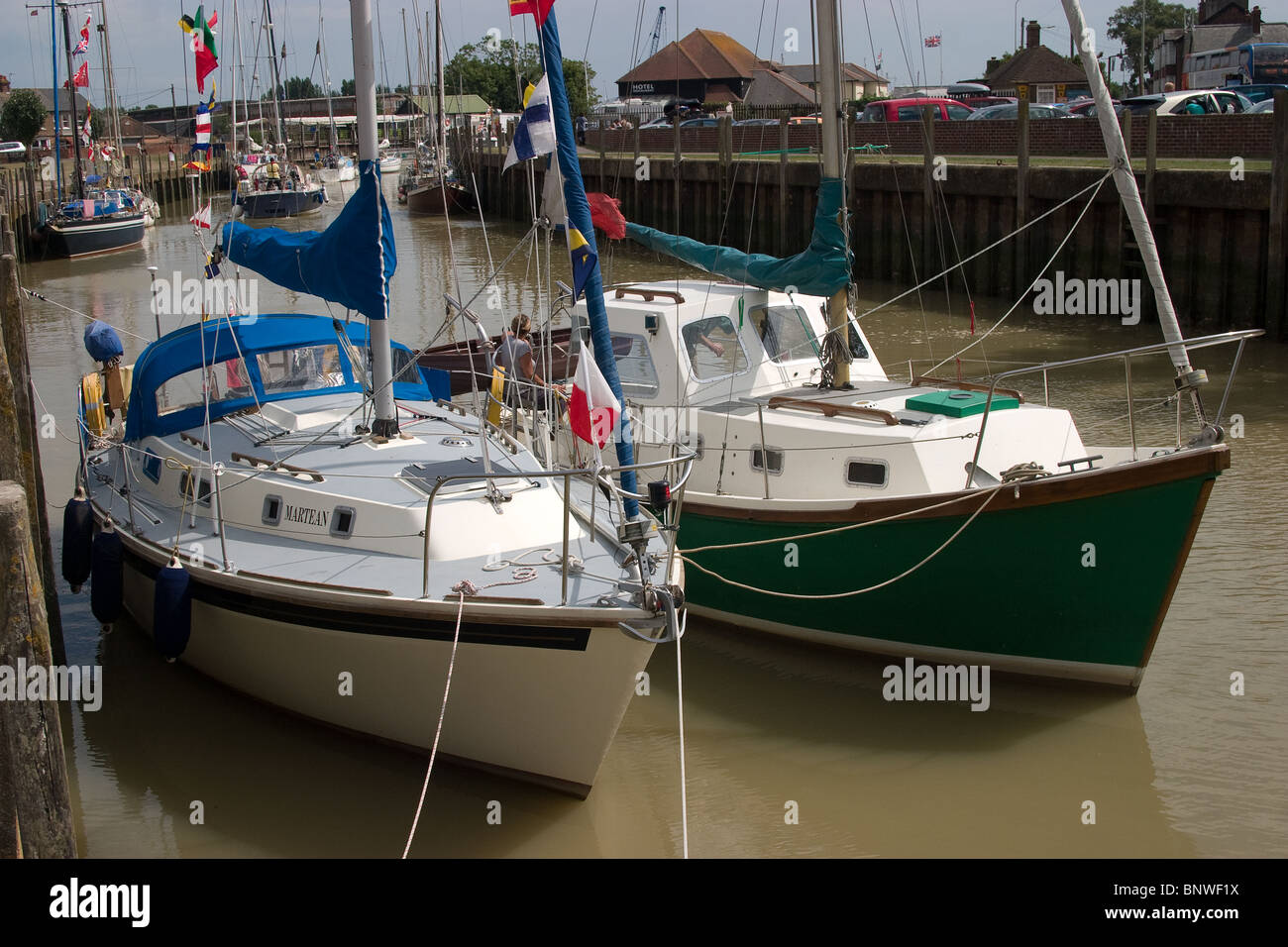 moored sail sailing boats double berthed quayside Stock Photo