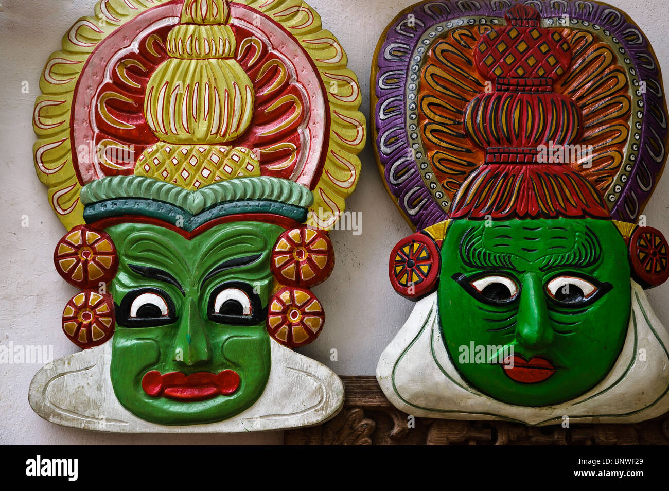 Hand crafted Kathakali Masks depicting the makeup used by Kathakali dancers in Kerala, South India Stock Photo