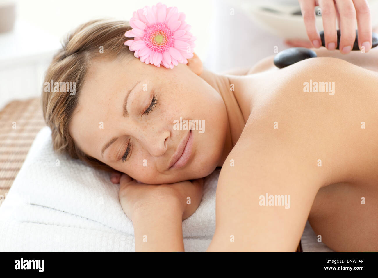 Portrait of a sleeping woman having a flower Stock Photo