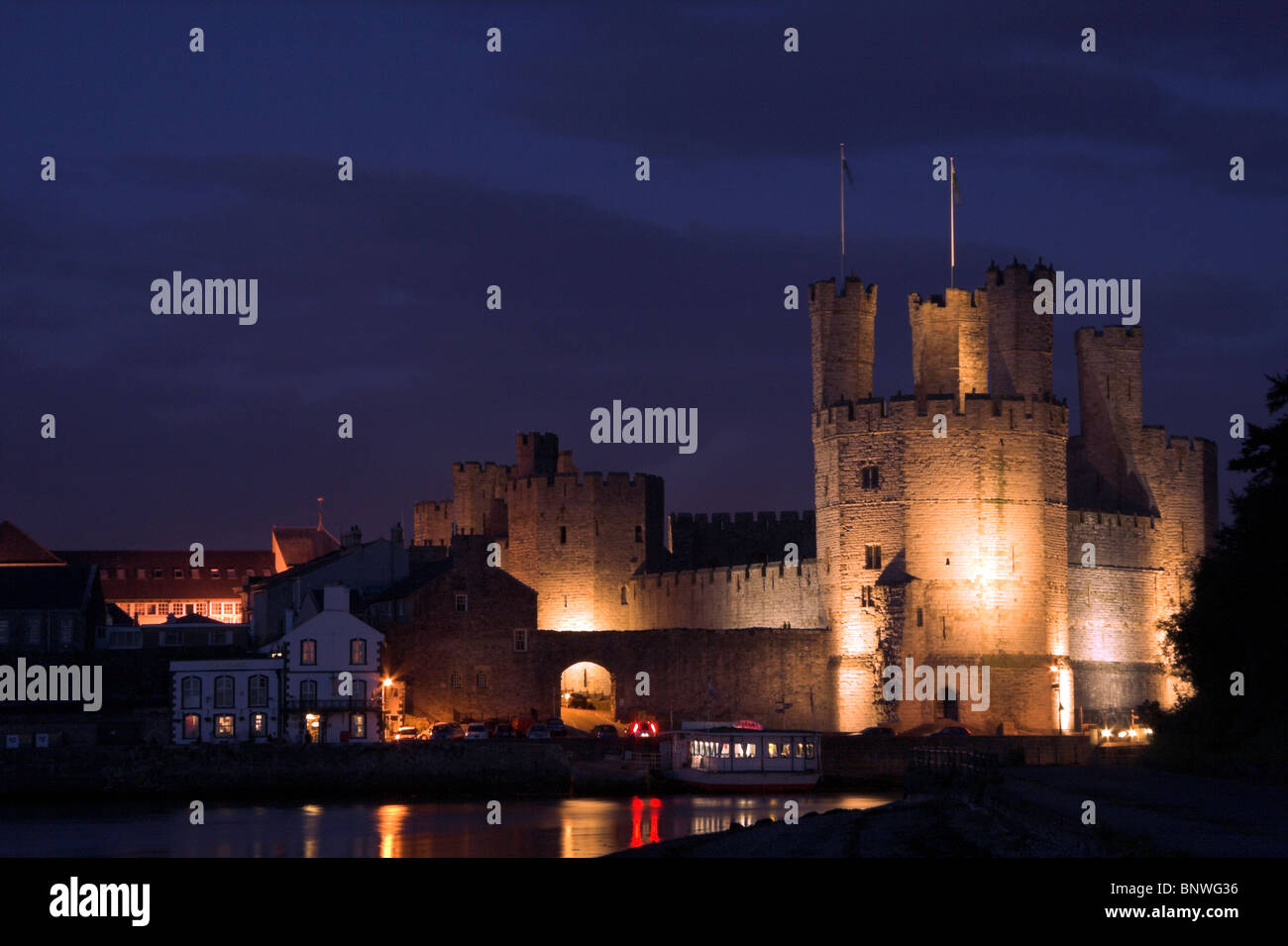 Caernarfon Castle lit up at night, North Wales, UK Stock Photo Alamy