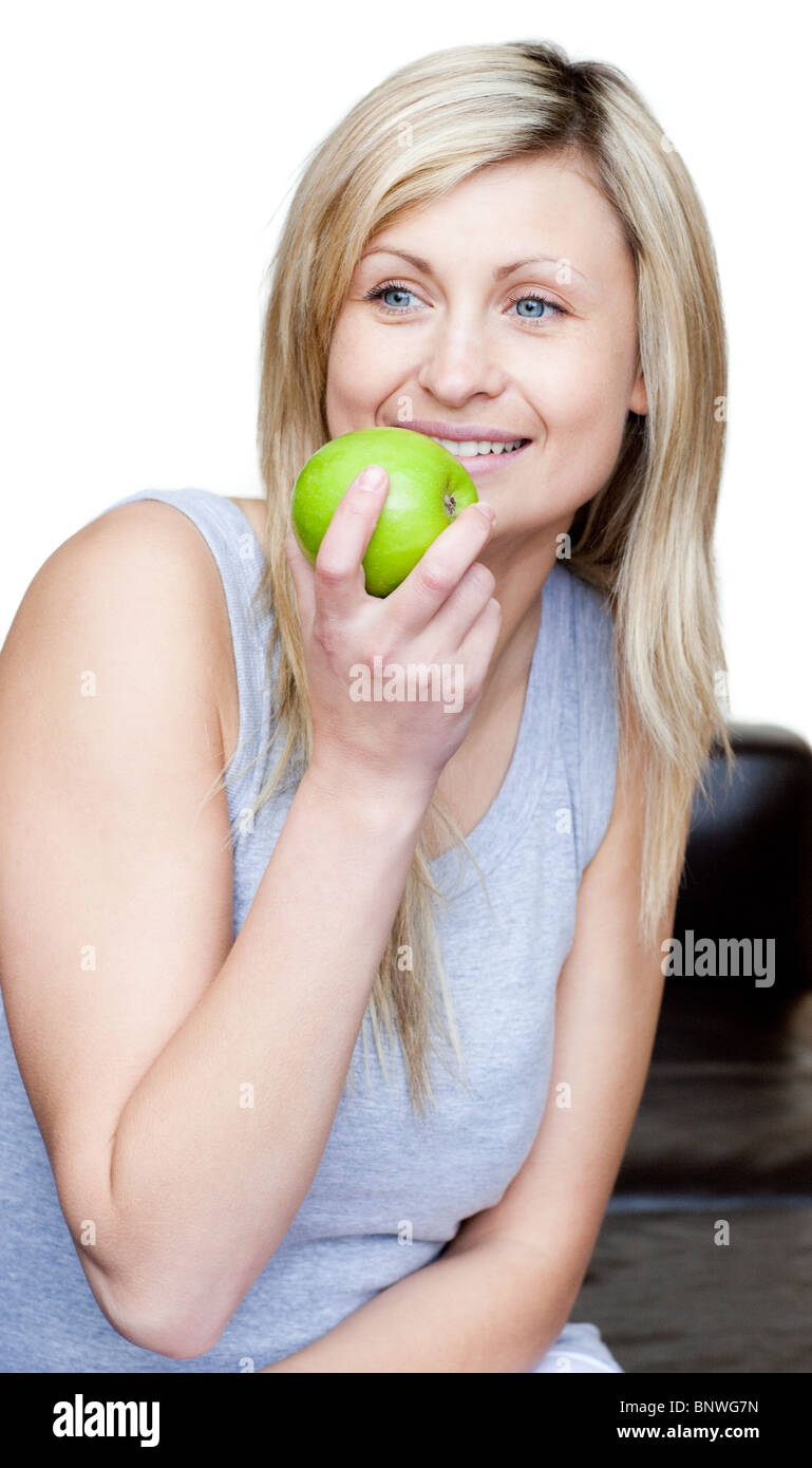 Young woman eating an apple Stock Photo Alamy