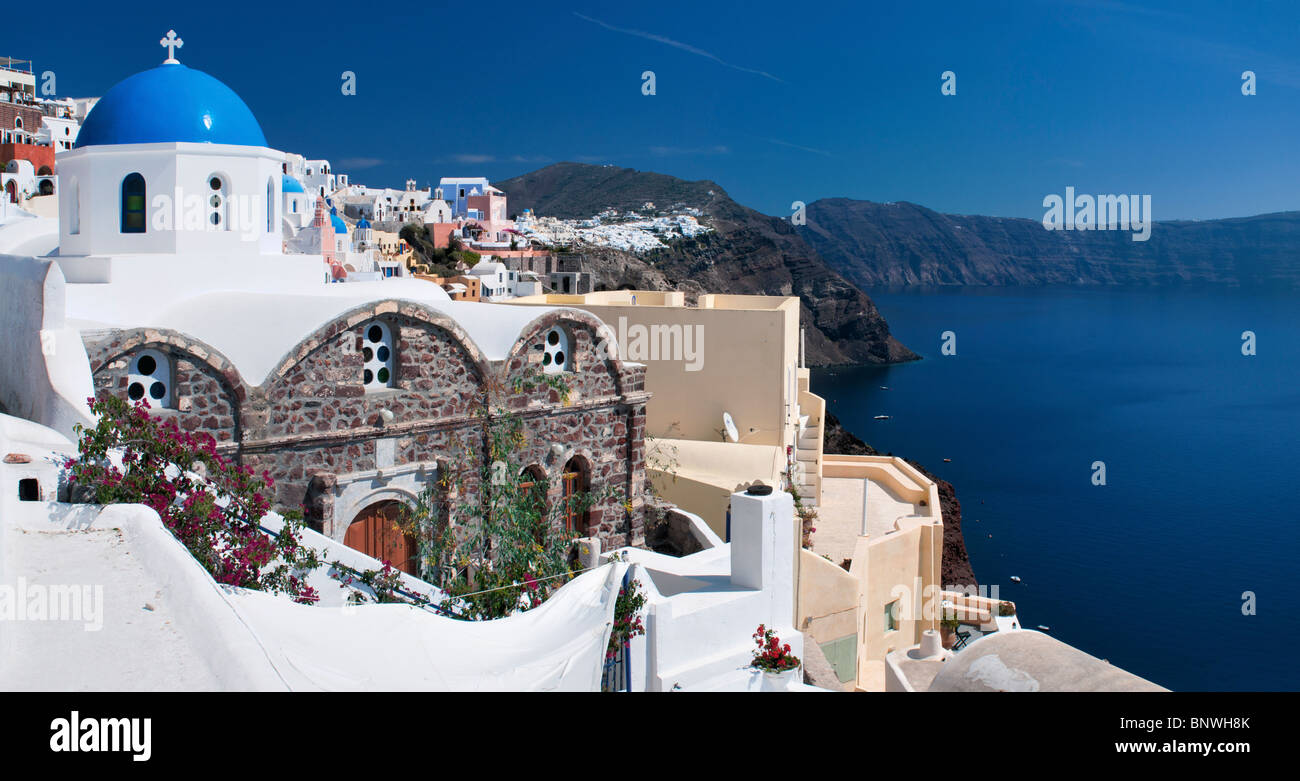 The pictures town of Oia is build on top of the caldera at the northern end of Santorini Island, Greece. Stock Photo
