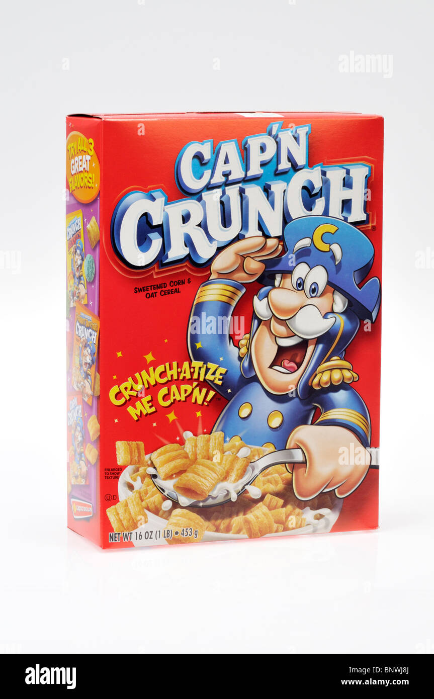 An unopened box of Cap'n Crunch sweetened corn and oat cereal on white background, cut out. Stock Photo