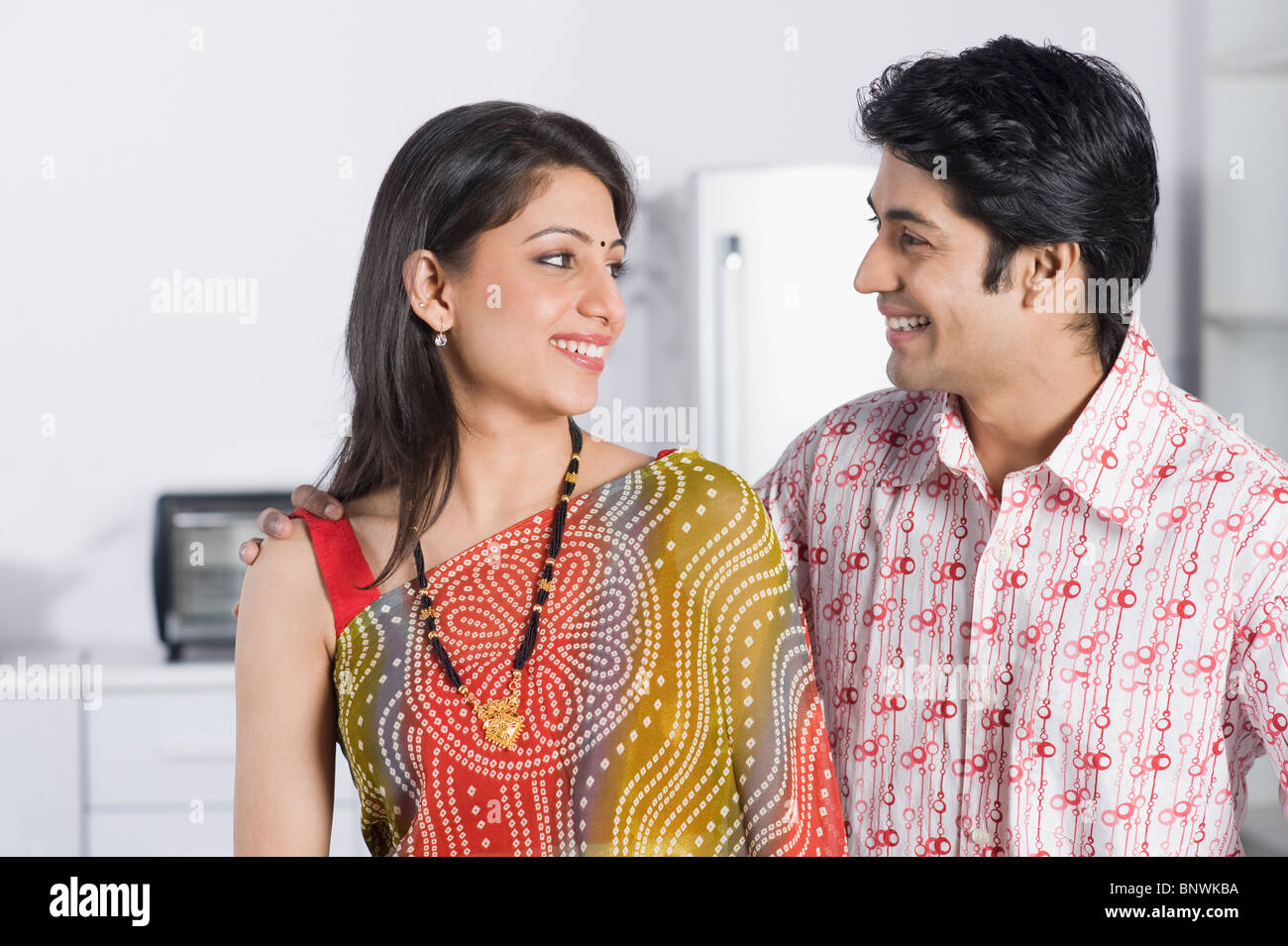 Close-up of a couple smiling at each other Stock Photo - Alamy