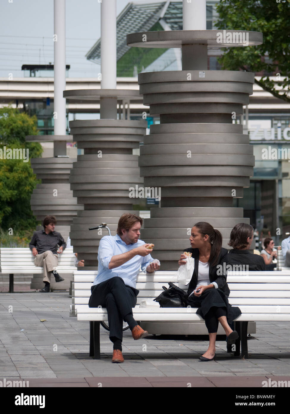 Office workers at lunch in modern business district at Amsterdam Zuid