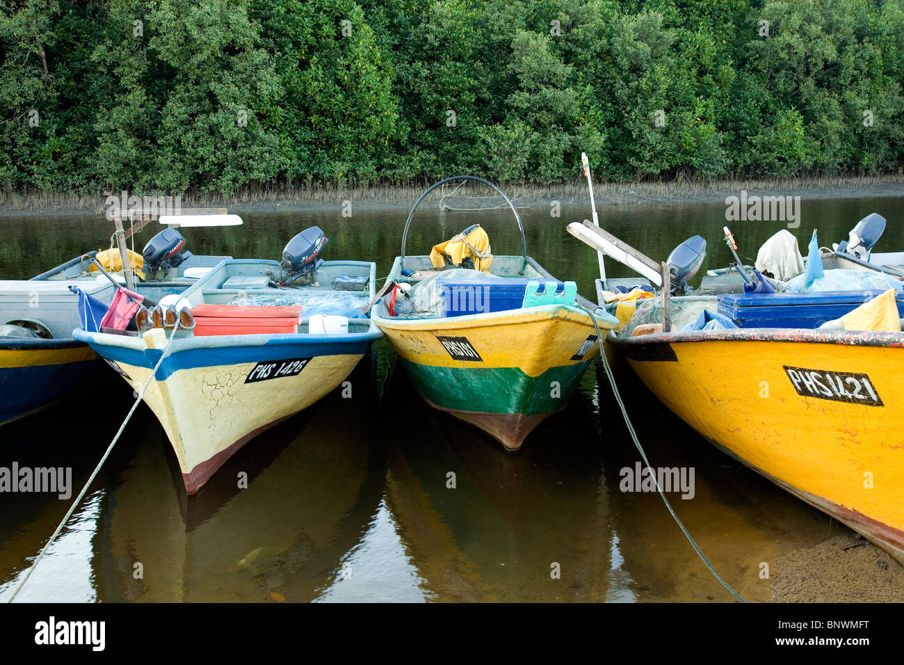 Moored fishing boats Stock Photo - Alamy