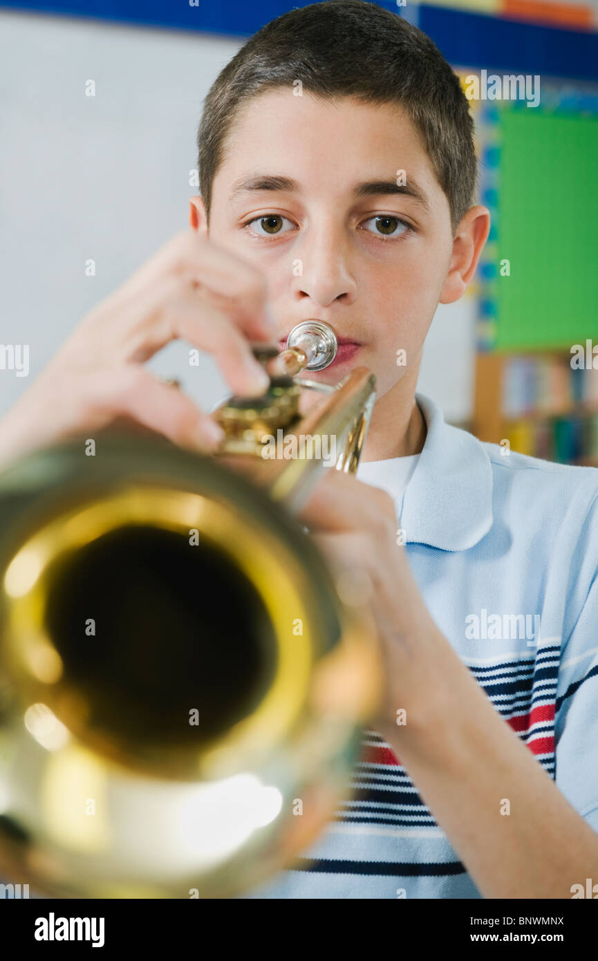 Elementary school student playing trumpet Stock Photo Alamy