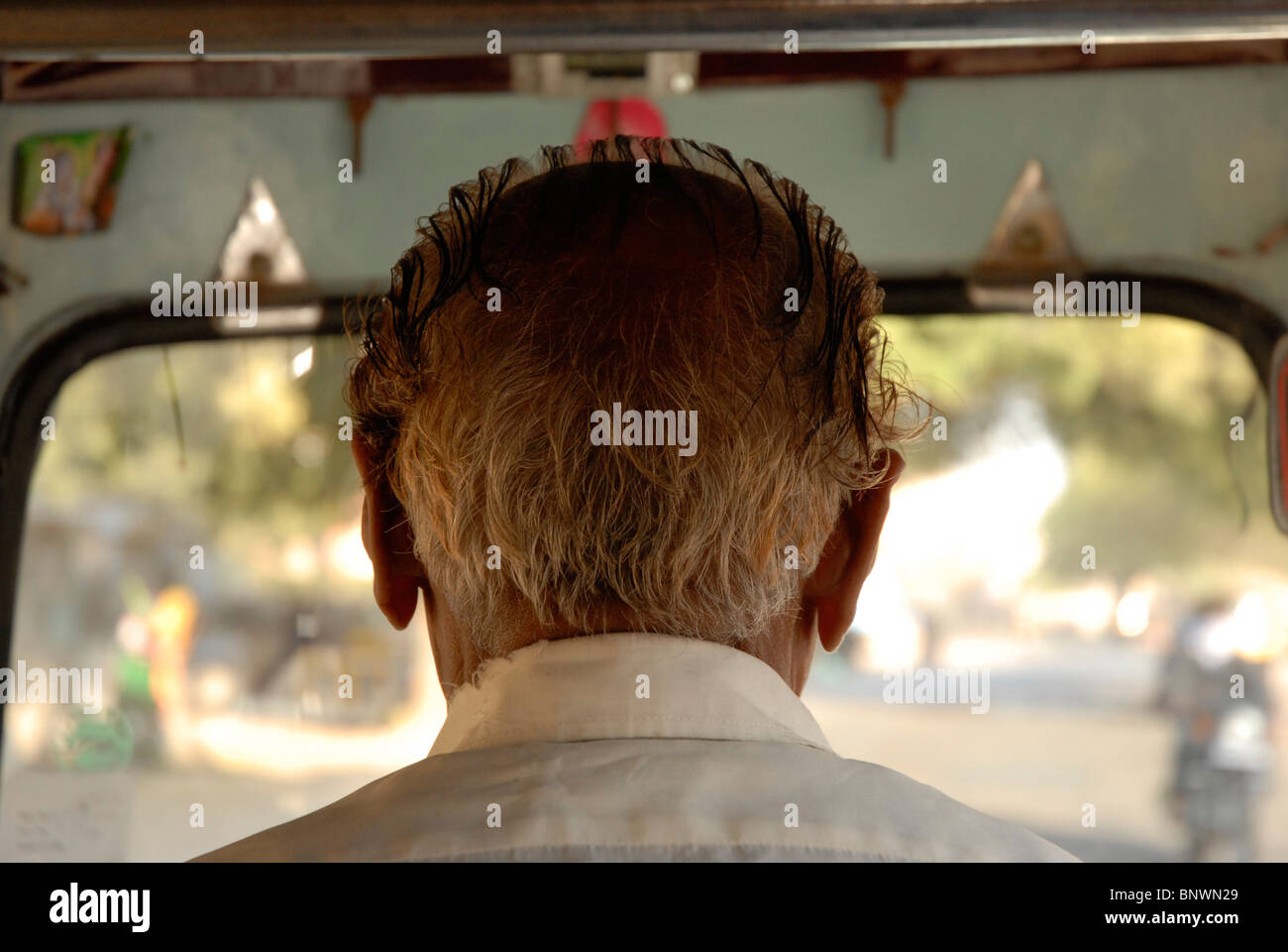 Back of the head of an Indian Auto rickshaw driver Stock Photo
