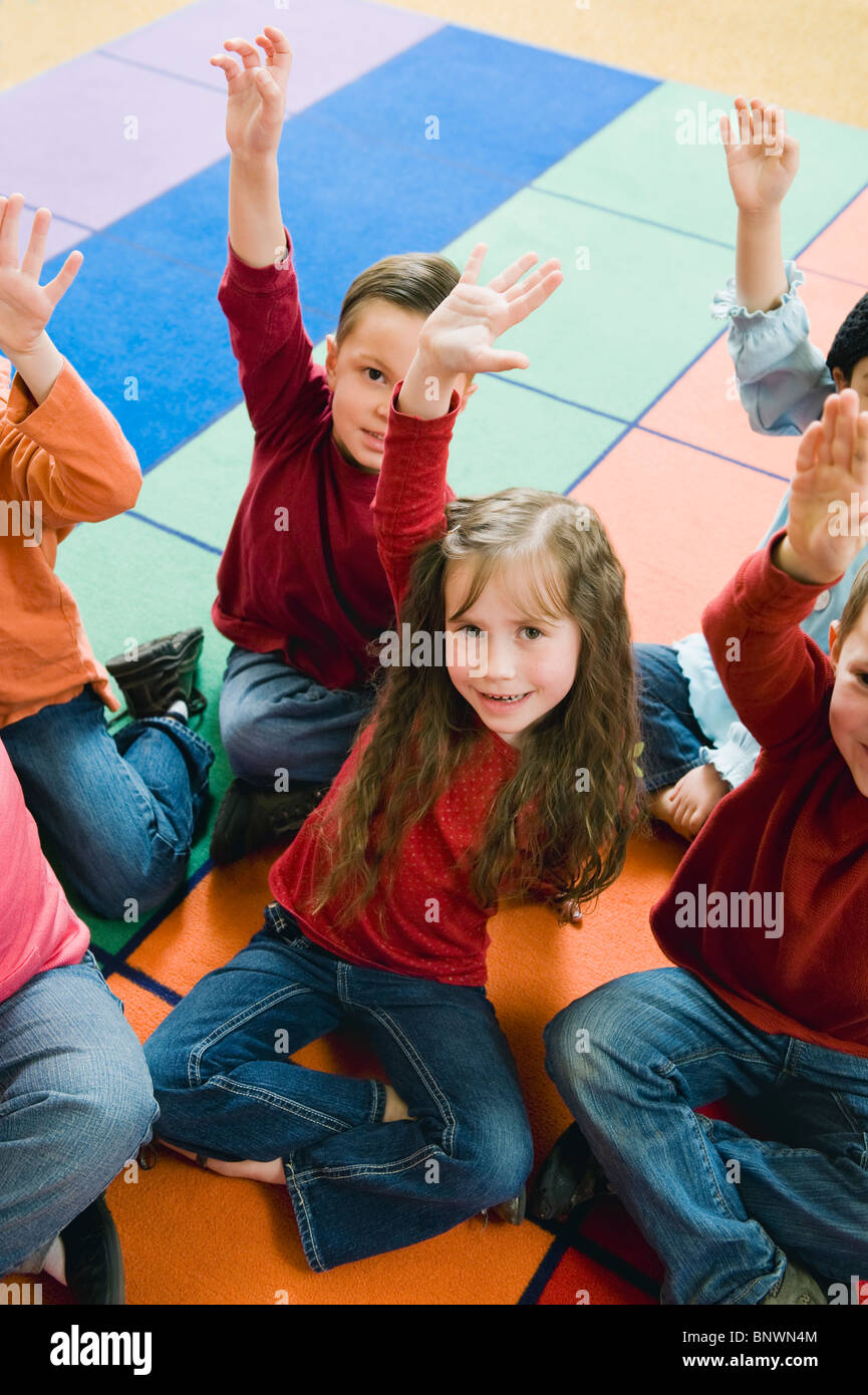 School children class hands up hi-res stock photography and images - Alamy