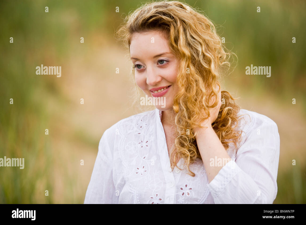 Portrait of attractive woman outdoors Stock Photo
