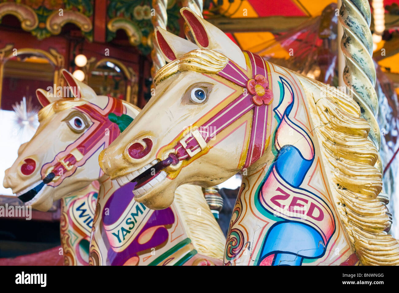 Traditional Fairground galloping horses Stock Photo