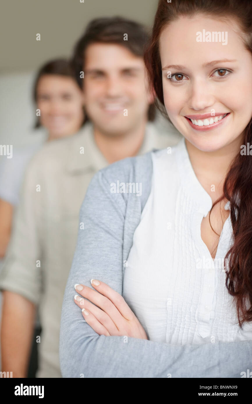 three people standing in a row Stock Photo - Alamy