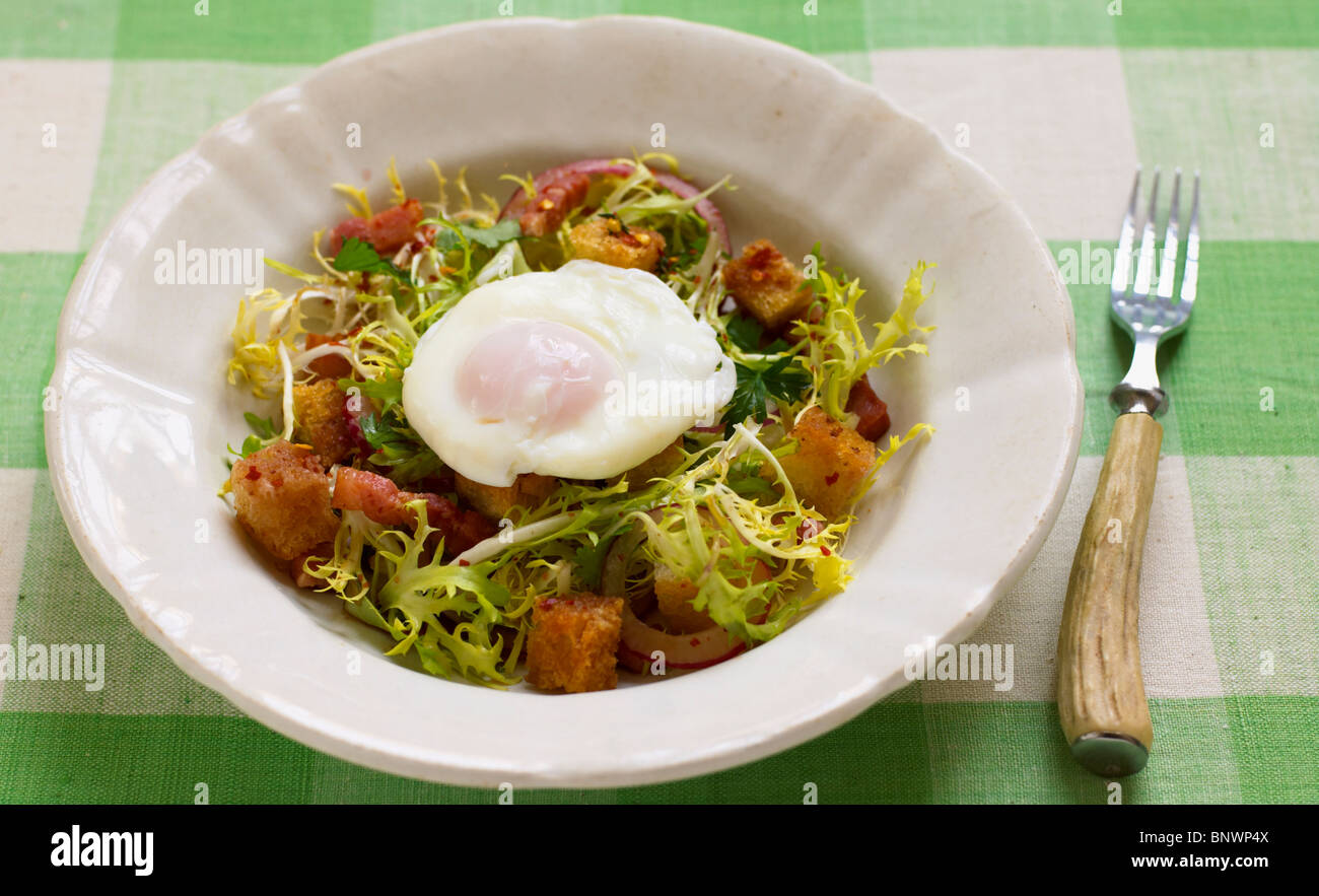 Bistro Salad With Frisee Lettuce Poached Egg Bacon Lardons And Stock Photo Alamy