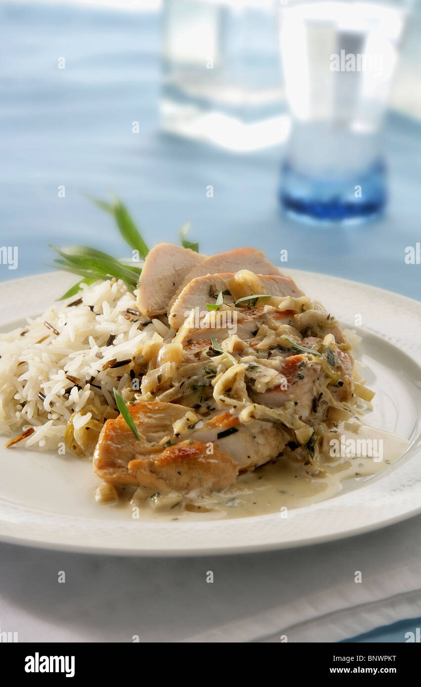 Creamy tarragon chicken served with wild rice hires stock photography and images Alamy