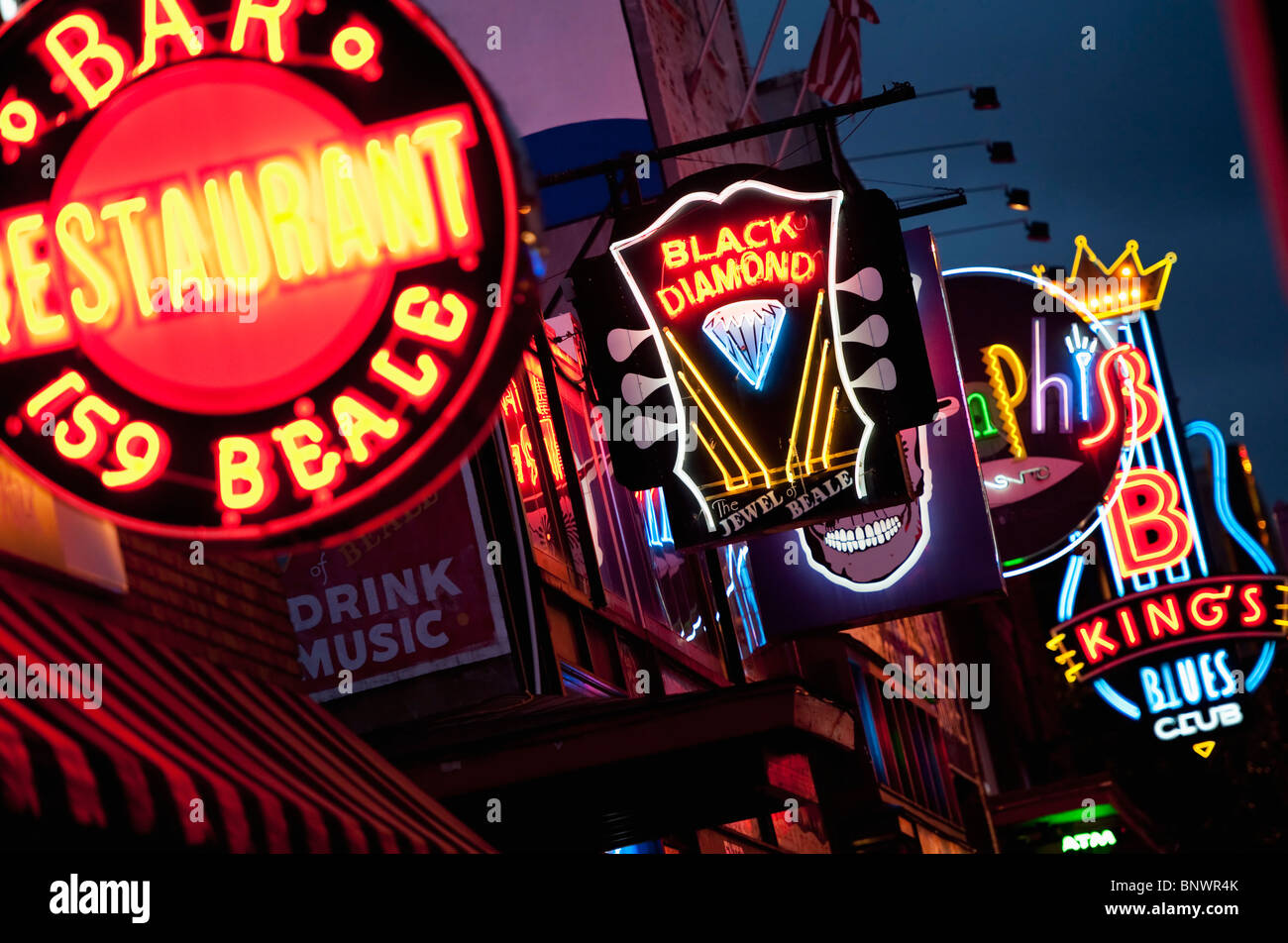 Illuminated bar signs on Beale Street in Memphis Stock Photo
