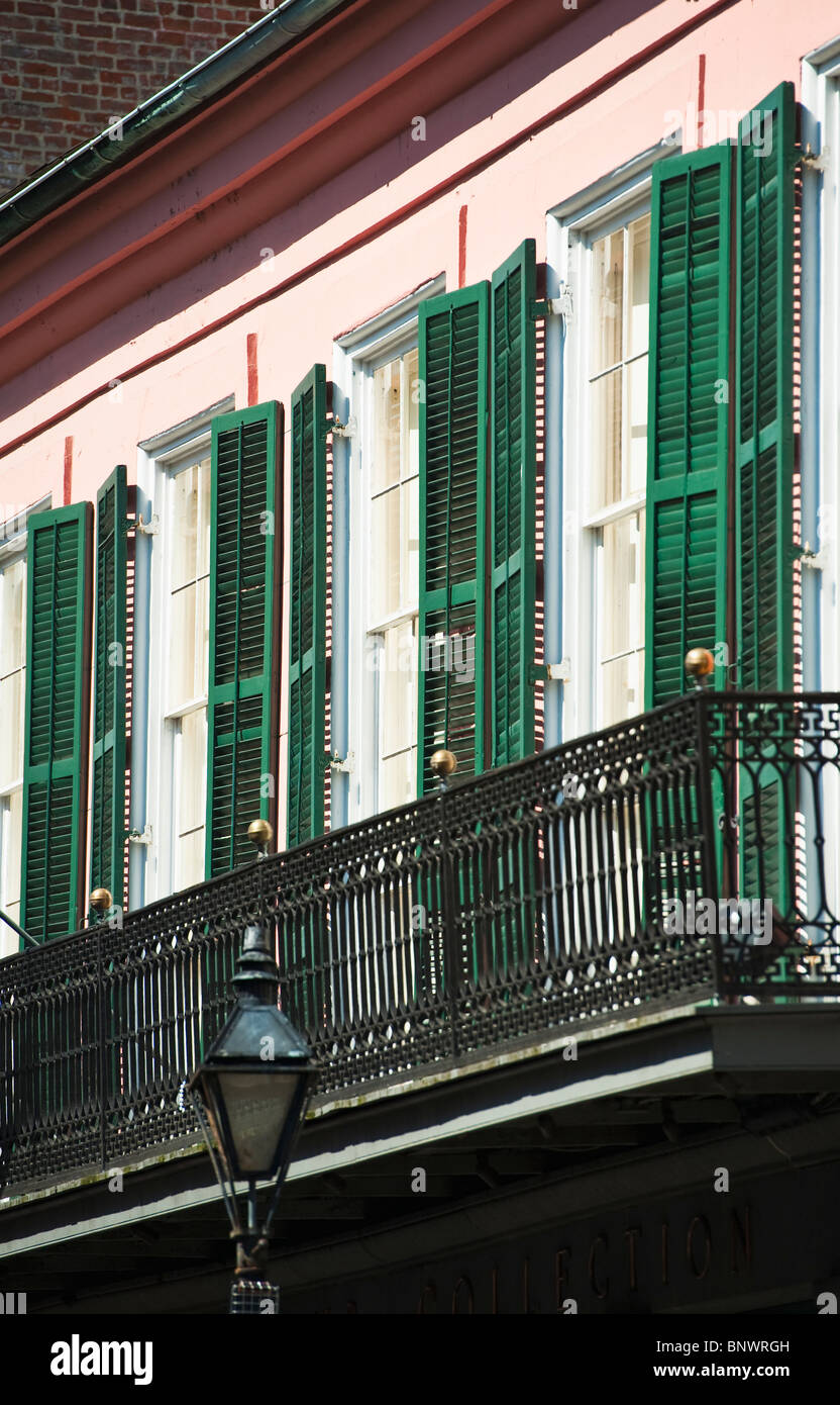 Balcony and windows with green shutters Stock Photo