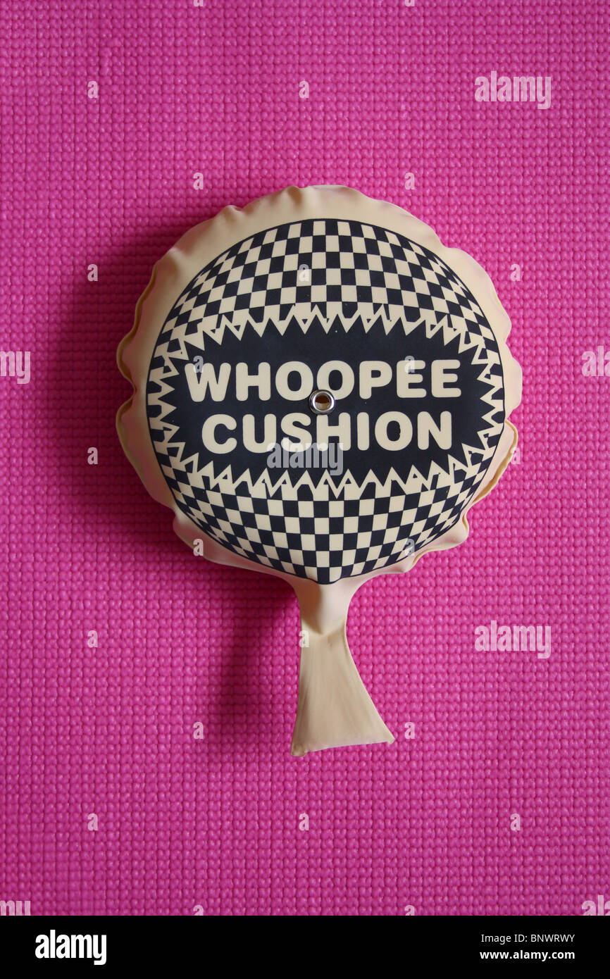 Whoopee cushion on pink background Stock Photo