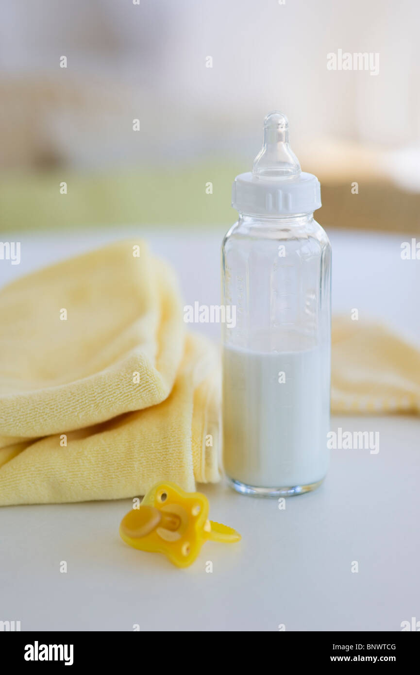 Baby bottle pacifier and blanket Stock Photo