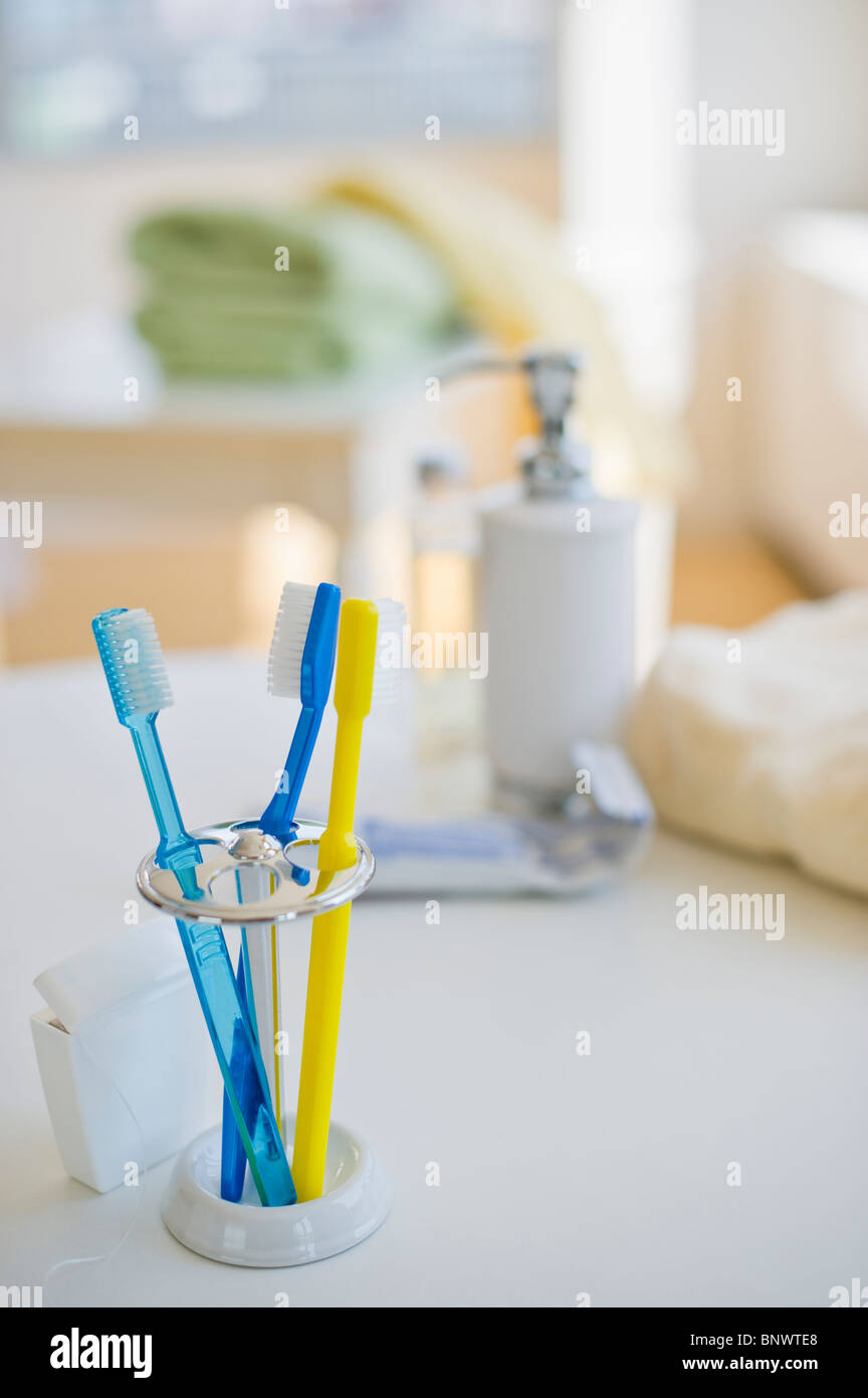 Toothbrushes in toothbrush holder Stock Photo