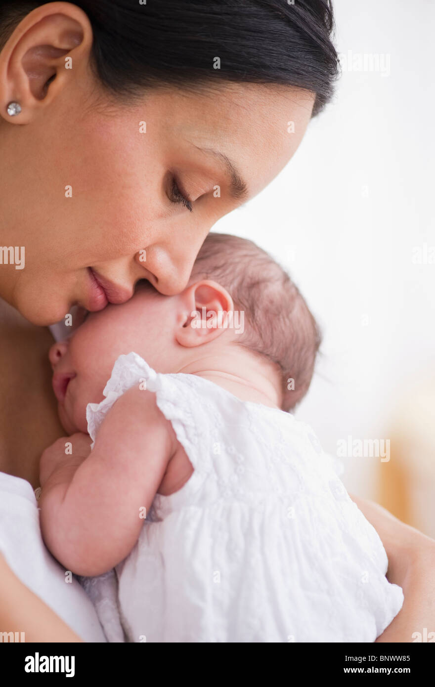 Mother holding her baby Stock Photo - Alamy