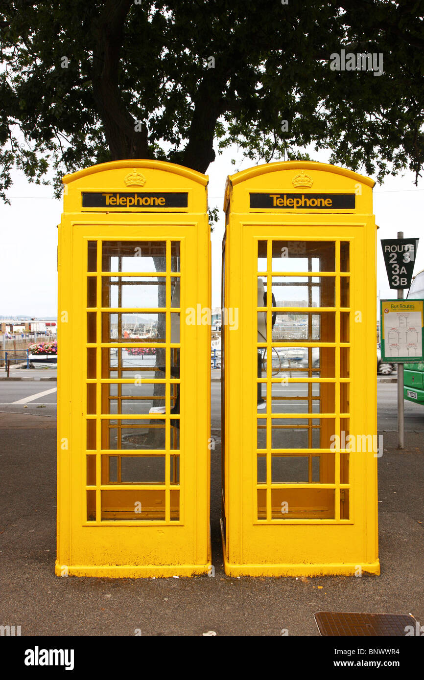 Typical yellow phone booth, St. Peter Port, Guernsey, Channel Islands, UK, Europe. Stock Photo