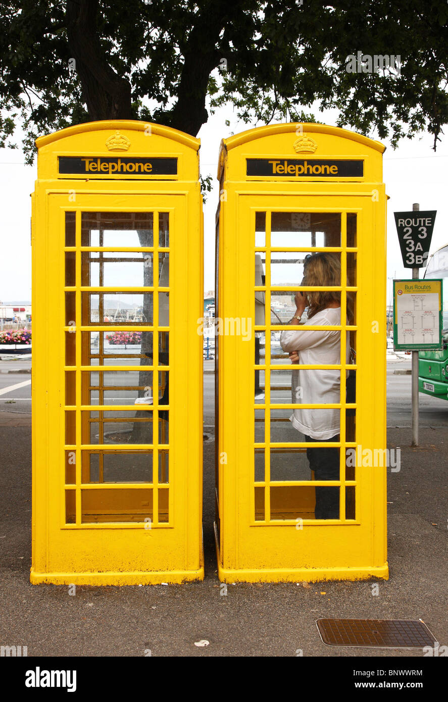 Typical yellow phone booth, St. Peter Port, Guernsey, Channel Islands, UK, Europe. Stock Photo