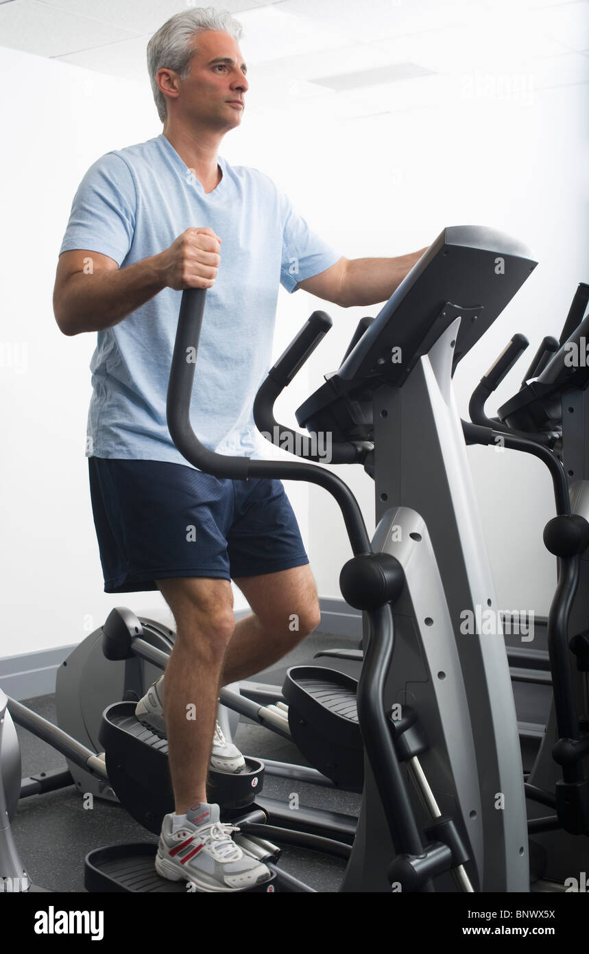 Man exercising on Stairmaster Stock Photo