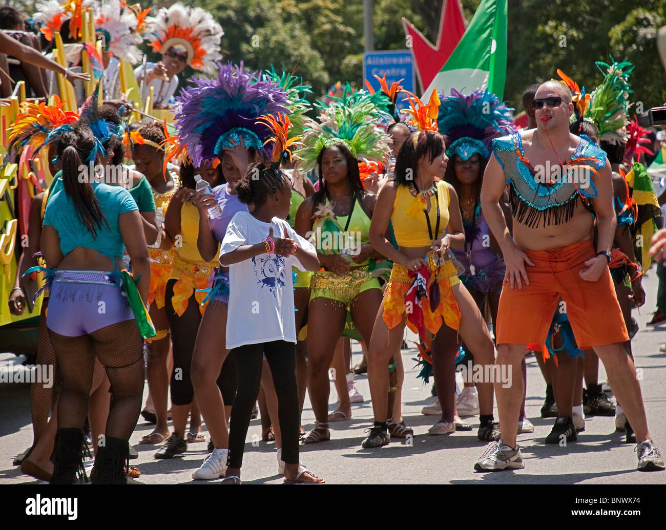 Group of unidentified Caribana participants in colorful dresses during the main parade on July 31, 2010 in Toronto Stock Photo