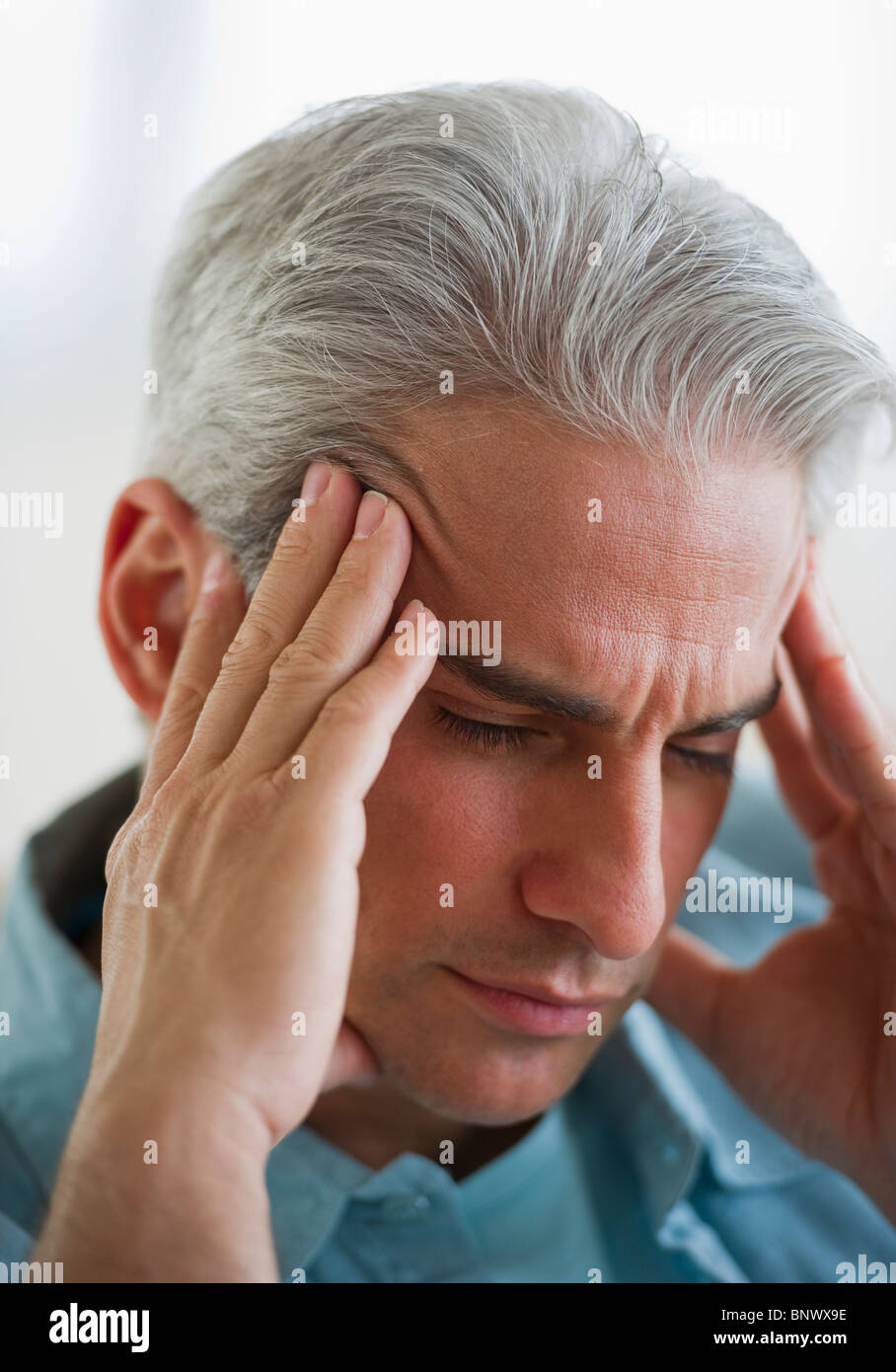 Man with a headache Stock Photo