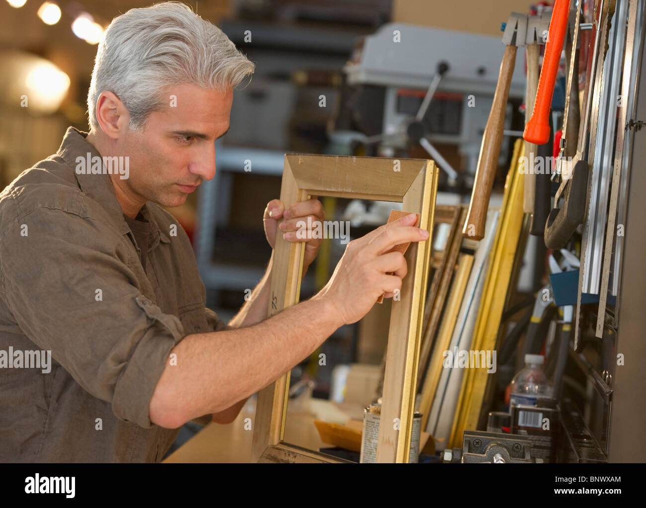 Craftsman making a picture frame Stock Photo