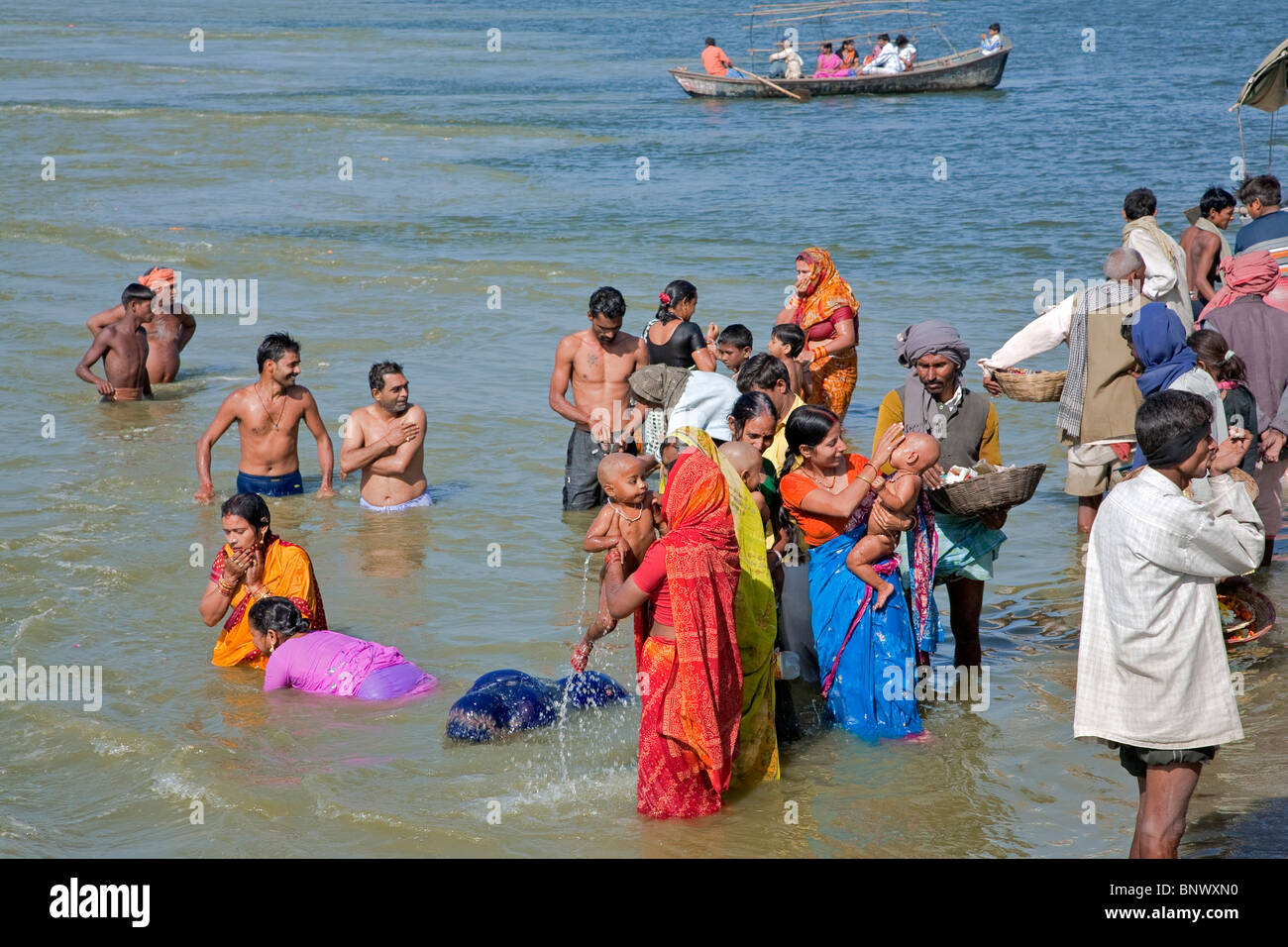 Hindu pilgrims bathing in the sacred Ganges river. Allahabad. India Stock Photo