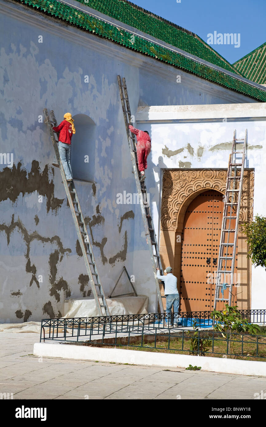 Ahl Fas Mosque showing main Doorway with painters, Rabat, Atlantic Coast, Morocco Stock Photo