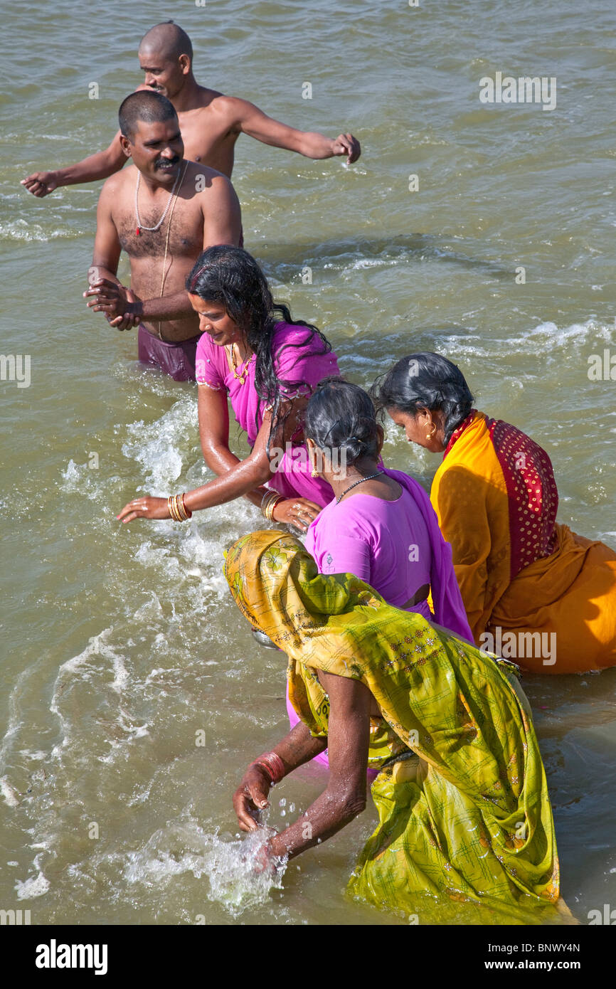 Hindu devotees bathing in the Ganges river. Allahabad. India Stock Photo