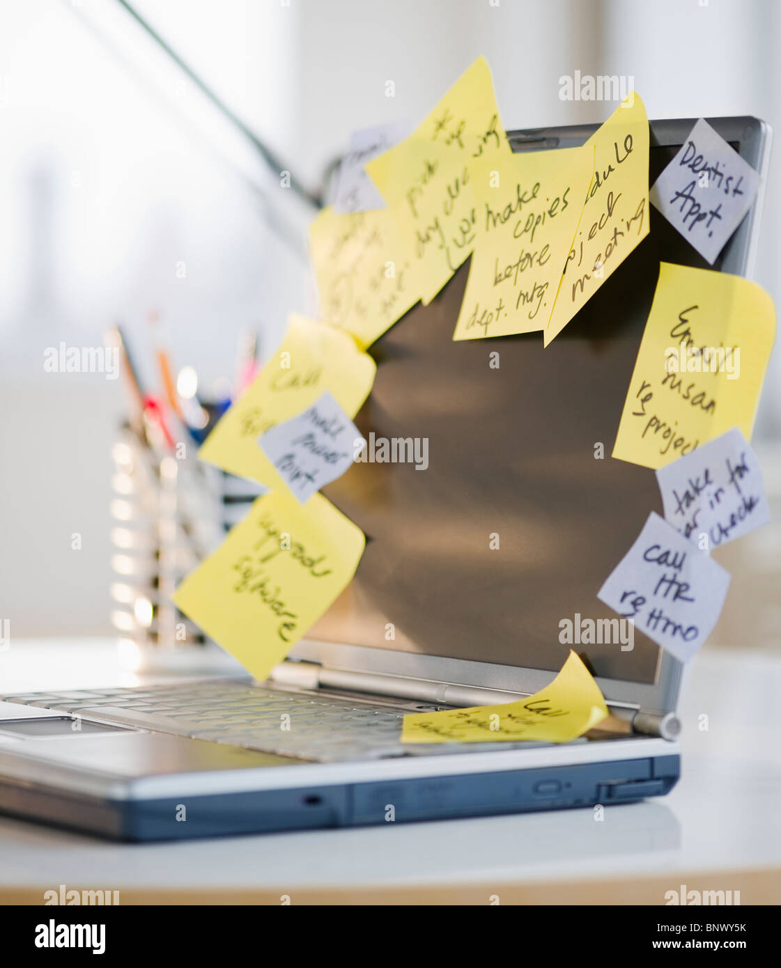 To-do notes stuck to laptop Stock Photo