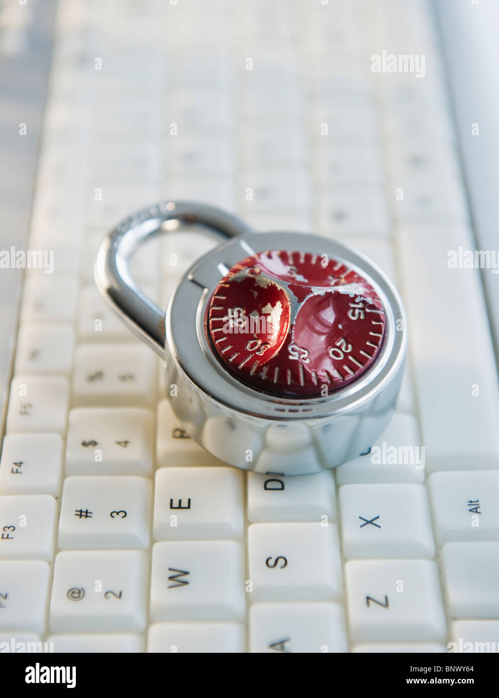 Combination lock on top of keyboard Stock Photo Alamy